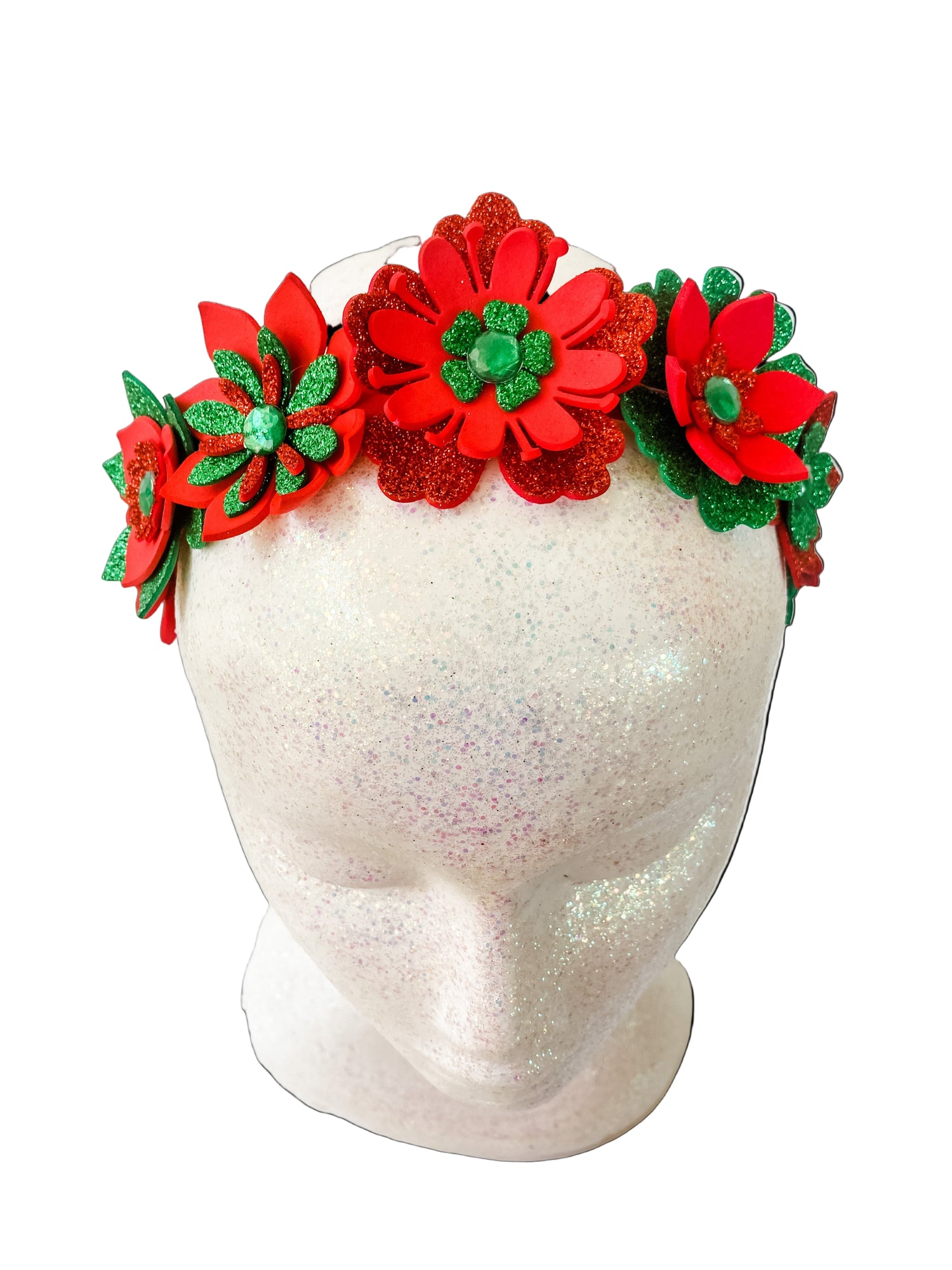 Red and green floral headband on a mannequin head with a white background