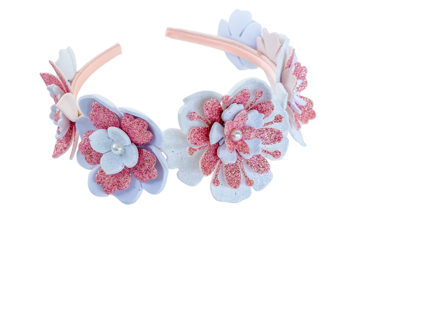 Floral headband with pink and white flowers on a light background