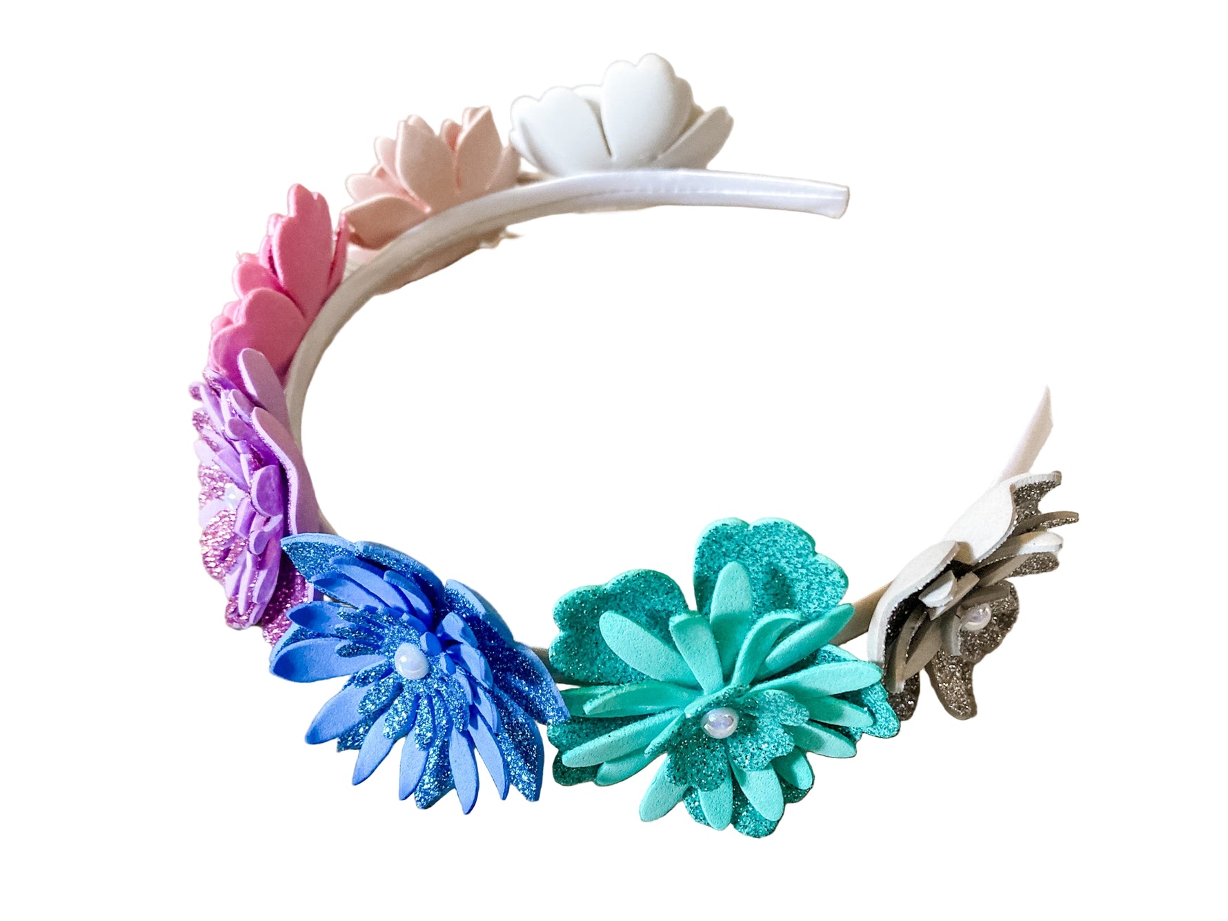 Colorful floral headband with antlers on a wooden surface