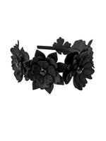Black floral headband on a white background