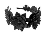 Black floral headband on a white background