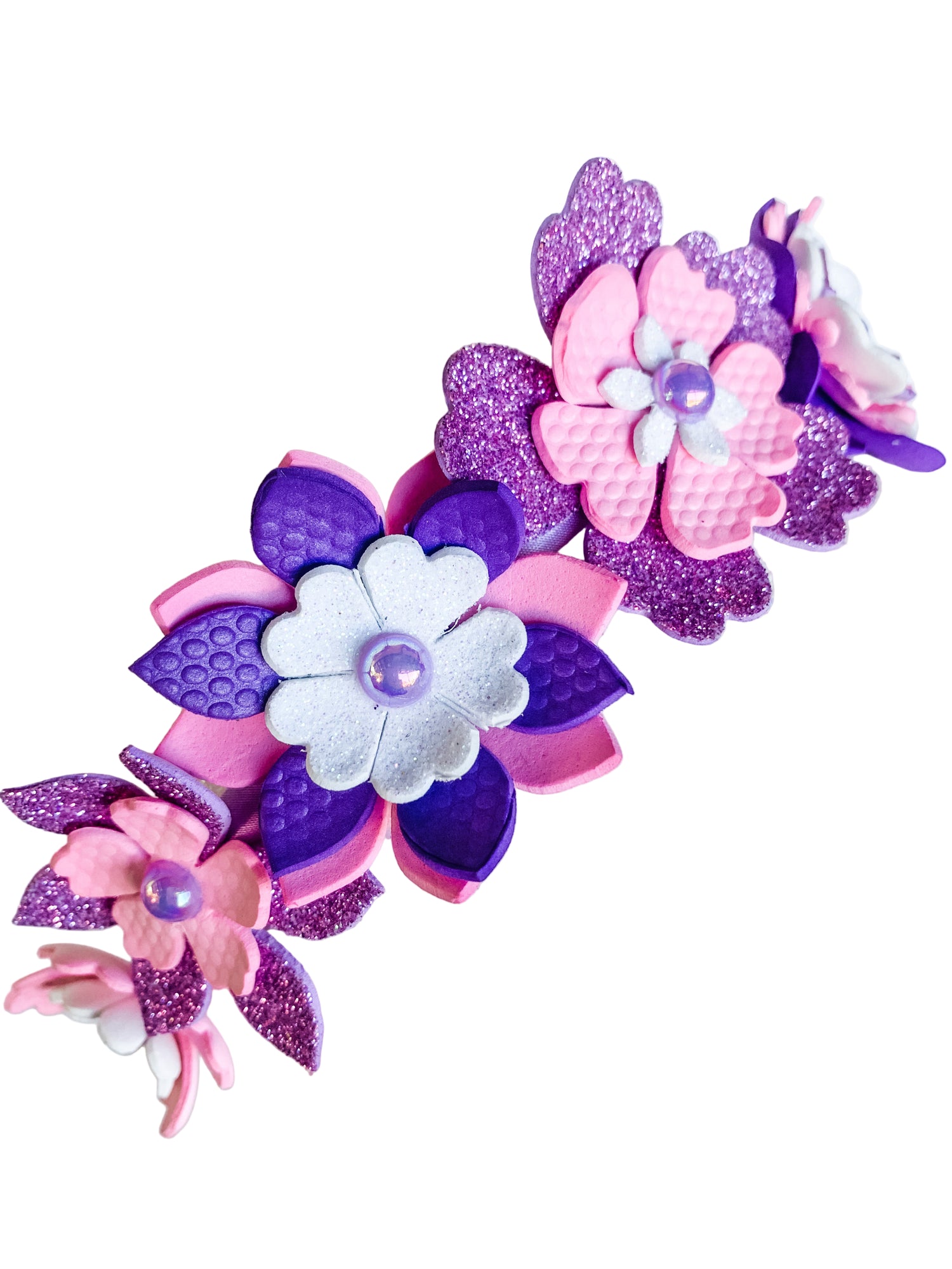 Decorative headband with pink and purple flowers on a white background